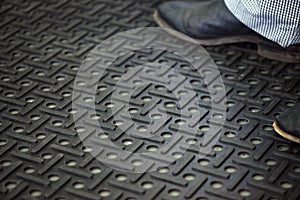 Workers standing on anti-fatigue mat in an industrial kitchen