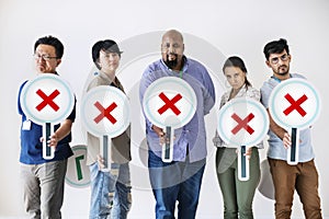 Workers standing and holding incorrect tick boxes photo