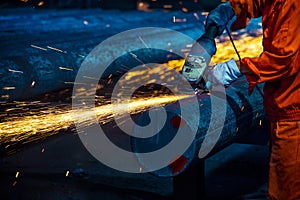 The workers in the steel mill are burnishing the steel