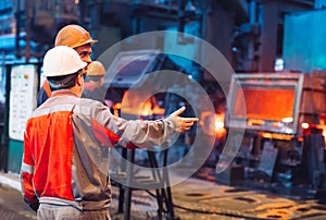 Workers in the steel mill. Metallurgical production or plant.