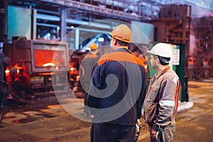 Workers in the steel mill. Metallurgical production or plant.