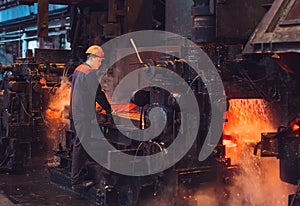 Workers in the steel mill. Metallurgical production or plant.