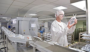 Workers in sterile protective clothing for quality control of in