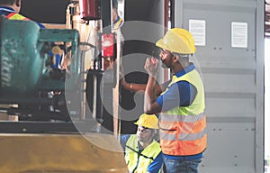 Workers team taking inventory in factory warehouse, Foreman workers working in warehouse talking about job, Warehouse forklift
