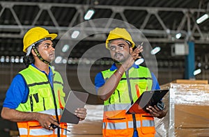 Workers team taking inventory in factory warehouse, Manual workers working in warehouse talking about job