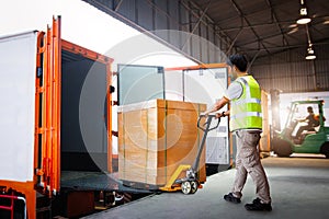 Workers Unloading Heavy Box into Container Truck. Trucks Loading Dock Warehouse. Supplies Warehouse Shipping., Cargo Transport,