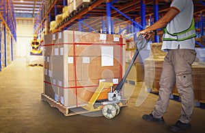 Workers Unloading Package Boxes on Pallets in Storage Warehouse. Forklift Pallet Jack Loader. Deliver Parcels to Customers