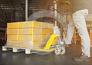 Workers Unloading Packaging Boxes on Pallet in Distribution Warehouse. Cardboard Boxes. Shipping Supplies Warehouse Shipment Boxes