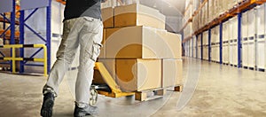 Workers Unloading Packaging Boxes on Pallet in Storage Warehouse. Cardboard Boxes. Shipping Supplies Warehouse. Shipment Boxes.