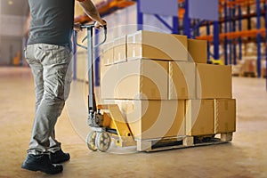 Workers Unloading Packaging Boxes on Pallet in The Warehouse. Cardboard Boxes. Shipping Supplies Warehouse. Shipment Boxes.