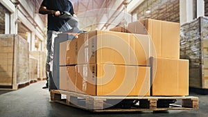 Workers Unloading Packaging Boxes on Pallet in Warehouse. Electric Forklift Loader. Cartons Cardboard Boxes. Supplies Logistics