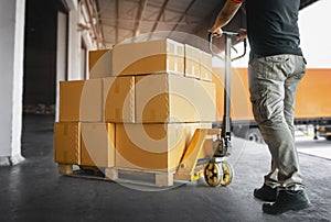 Workers Unloading Packaging Boxes on Pallets to The Warehouse. Cartons Cardboard Boxes. Shipping Warehouse. Delivery. Shipment Box