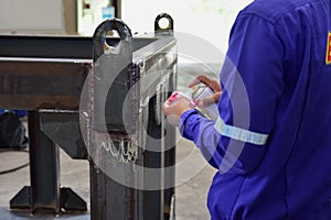 Workers use cleaner for remove the penetrant..This is second step of Penetrant Testing PT.