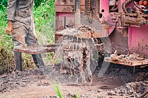 Workers use underground water drilling machine blur