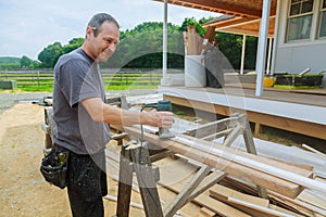 workers using electric routering to cut down stripes