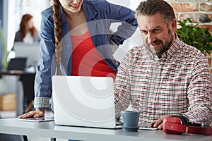 Workers using laptop