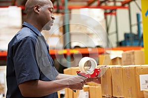 Workers In Warehouse Preparing Goods For Dispatch