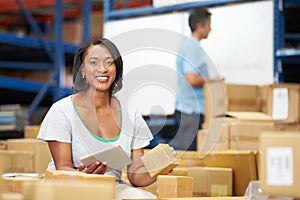 Workers In Warehouse Preparing Goods For Dispatch