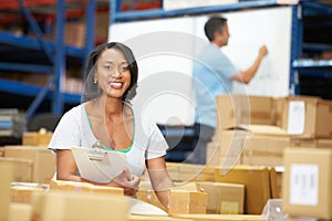 Workers In Warehouse Preparing Goods For Dispatch