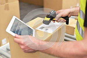 workers in the warehouse scanning parcels for retail and transport shipping photo