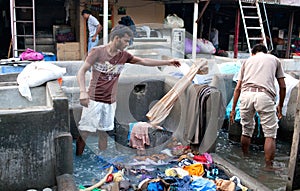 Workers washing clothes at Dhobi Ghat in Mumbai, India