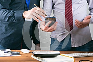 Workers are watching the phone