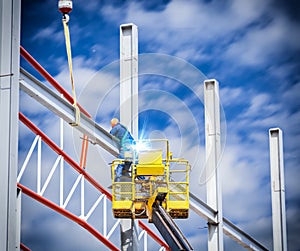 Workers welded steel structures