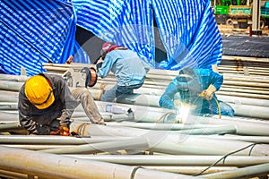 Workers welded steel structures