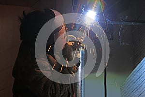 Workers welding operation