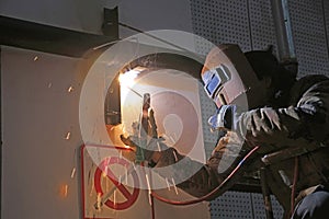 Workers welding operation