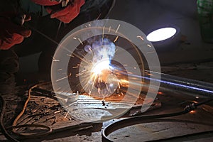 Workers welding operation