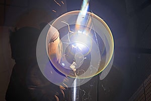 Workers welding operation