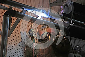 Workers welding operation