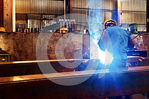 Workers at work, ongoing welding operation