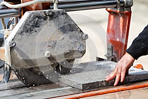 Workers are working, cutting marble cutter
