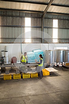 Workers working together near production line