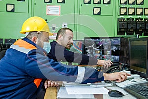 workers with yellow helmet and protective mask at work