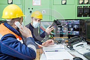workers with yellow helmet and protective mask at work