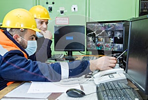 workers with yellow helmet and protective mask at work