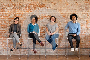 Workgroup smiling and looking at camera