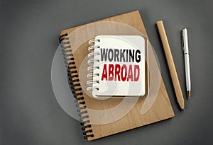 PROJECT MANAGER text on notebook with clipboard on white background