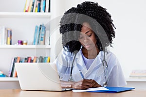 Working african american nurse or medical student