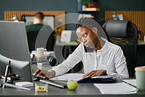 Working African American Woman Talking on Smartphone