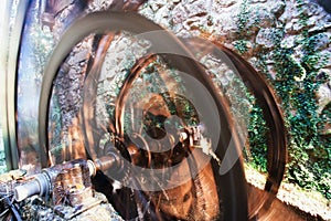 Working ancient millwheel blurred by rotation