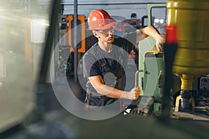 Working atmosphere in metal sheet factory with large industrial machines