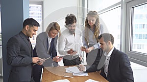 Working atmosphere in the office. Group of business people discussing business issues.