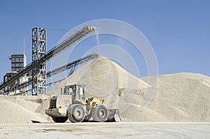 Working belt conveyors and a piles of rubble in Gravel Quarry