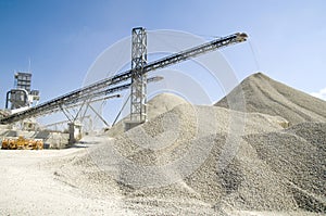 Working belt conveyors and a piles of rubble in Gravel Quarry photo