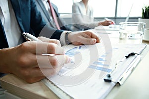 Working business people analyse high performance marketing data. photo
