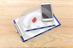 Working with cellphone and Blue Waiter notepad Clipboard with P